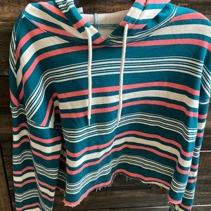 A hoodie, size L; with pink and white strips.